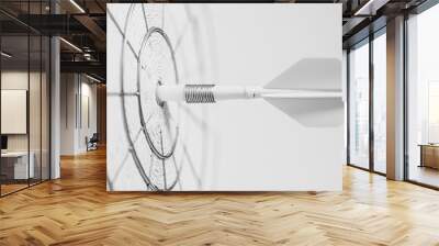 A white dart aimed directly at the target on a plain white background, highlighting simplicity and focus with a monochromatic theme. Wall mural