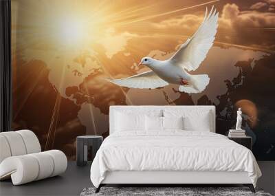 A white dove flying above a world map, with bright rays of light symbolizing hope and peace shining from behind Wall mural