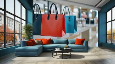 Colorful handbags displayed in a modern store, highlighting fashion and luxury shopping experience in an elegant retail environment. Wall mural