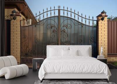 Forged metal gates with ornate lines to enter a private house Wall mural