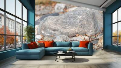 A large rock sits on a pile of rocks Wall mural