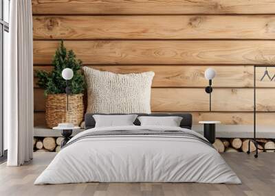 A cozy wooden wall scene featuring a stone shelf, a green plant in a woven basket, and a textured pillow, creating a warm, inviting atmosphere. Wall mural