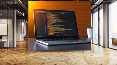 Laptop showing code on the screen placed on a desk with a green plant and warm sunlight streaming in against a brick wall background. Wall mural