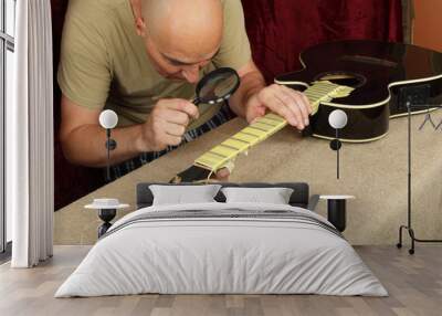 Guitar repair and service - Worker control sharpen special tool bridge servo nut black guitar Wall mural