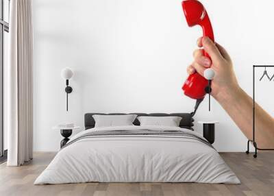 Objects Hands action - Hand holds retro phone red handset. Isolated Wall mural