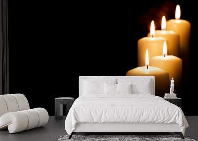 Burning candles on dark background. front view. Wall mural