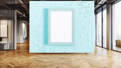 Christmas, winter composition. Xmas holiday decorations, photo frame on pastel blue background. Christmas, New Year, winter concept. Flat lay, top view, copy space Wall mural