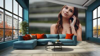 Portrait of young positive Woman with brown hair Wall mural