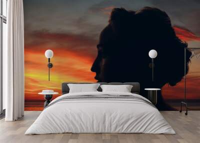 Woman silhouette with sun and clouds in her head Wall mural