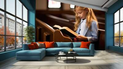 girl in church pew reading a bible Wall mural