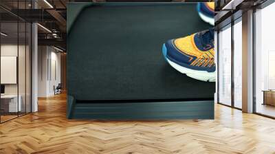 Close up running shoe on the electric treadmill in fitness Wall mural