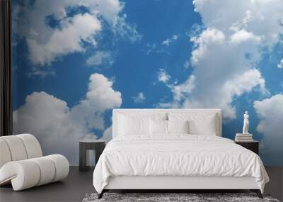 a blue sky with white clouds Wall mural