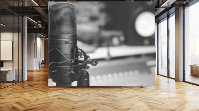 black and white condenser microphone on audio mixing board & studio monitor speakers background. recording concept Wall mural