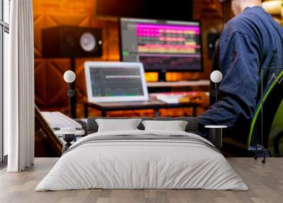 male producer, musician, composer making a song in home recording studio. music production concept Wall mural