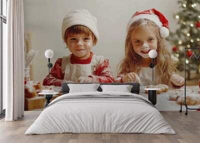 Two kids baking cookies together, flour dusting their faces, with a table full of festive decorations on a solid white background. Wall mural