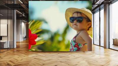 young child in sunglasses and straw hat enjoying tropical vacation Wall mural