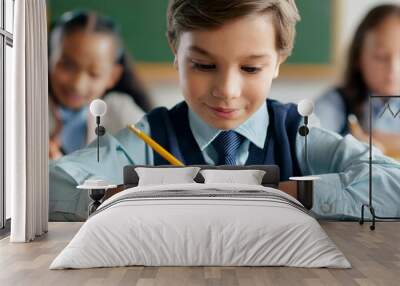 Primary school, boy in classroom, close-up on pencil, concept of education and school life Wall mural