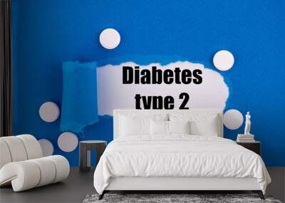 The text Diabetes type 2 appearing behind torn blue paper. Wall mural