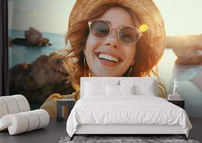 Beautiful woman with sunglasses, hat and a beautiful smile Wall mural