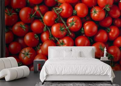 A close up view of ripe red tomatoes with green stems. Wall mural