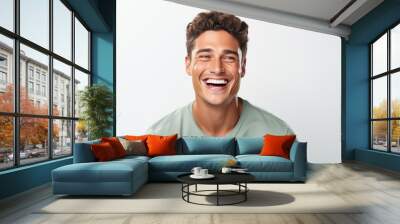 Handsome young man with perfect clean teeth laughing and smiling isolated on white background. Wall mural