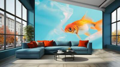 Single goldfish swimming through plastic bag in blue water. Wall mural