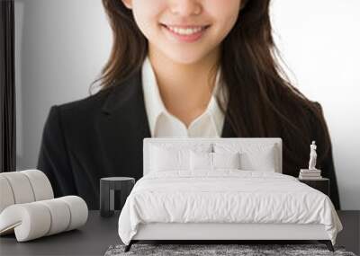 Young Asian businesswoman in suit smiling at camera isolated. Wall mural