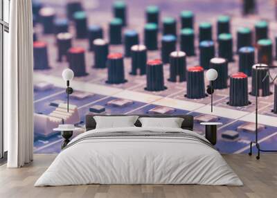 View of the mixing console in the Studio. Buttons, faders and sliders. Selective focus Wall mural