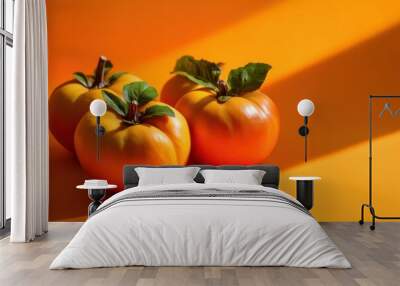 Persimmons on the orange background Wall mural