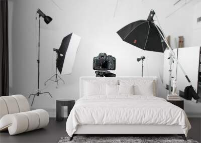 Empty photo studio with lighting equipment and camera Wall mural