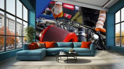 Automobile mechanic repairing a car engine. man fixing the engine car. service and maintenance. Wall mural