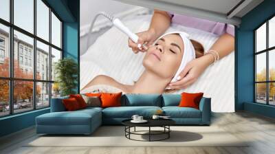 beautiful woman getting microdermabrasion procedure in a beauty spa salon Wall mural