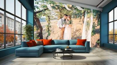 bride and groom hugging at the wedding in nature. Wall mural