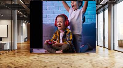 children playing video game with game console Wall mural