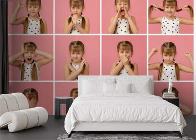 collage of portraits of little girl with different emotions on pink background. Human emotions and facial expression Wall mural