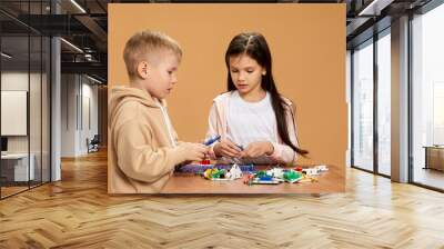 cute children playing with electronic constructor at studio Wall mural