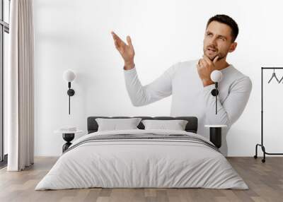 portrait of doubtful bearded man in casual white shirt asking questions isolated on white background. copy space Wall mural