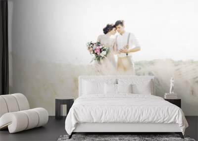 wedding couple on  nature.  bride and groom hugging at  wedding.  Wall mural