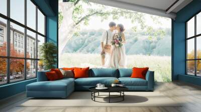 wedding couple on  nature.  bride and groom hugging at  wedding.  Wall mural