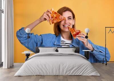 woman covering her eyes with a slice of fresh pizza Wall mural