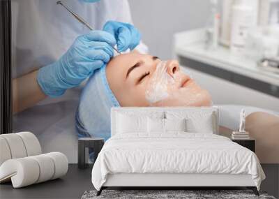 woman during a mechanical face cleansing procedure Wall mural