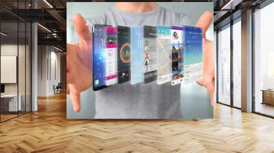 Businessman holding 3d rendering app template on a smartphone Wall mural