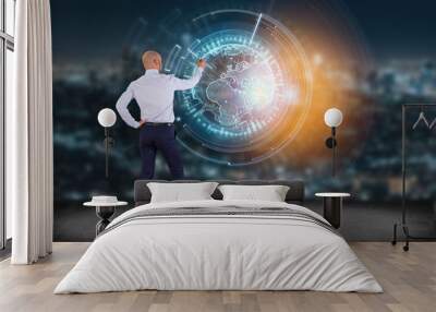 InternatiBusinessman in front of a wall with a  globe communication displayed on a futuristic interface - Business and technology connection Wall mural