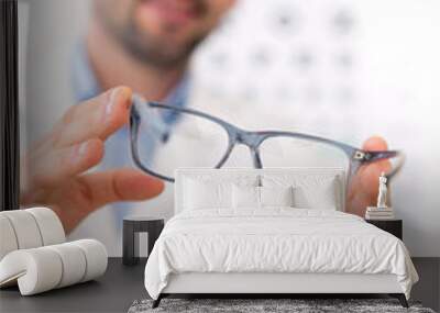 Ophthalmologist make you try new glasses Wall mural