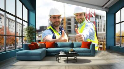 Portrait of an attractive worker and an architect on a construct Wall mural