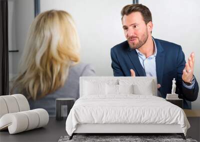 young attractive employer doing a job interview to a woman Wall mural