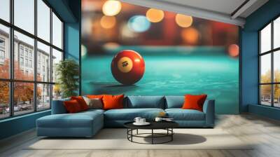 a pool ball sitting on top of a table in a room with lights in the background Wall mural