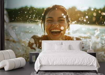 a woman is smiling while she is in the water Wall mural