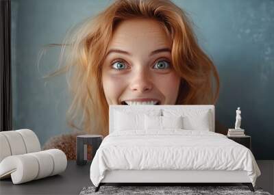 a woman with a surprised look on her face and a sweater on Wall mural