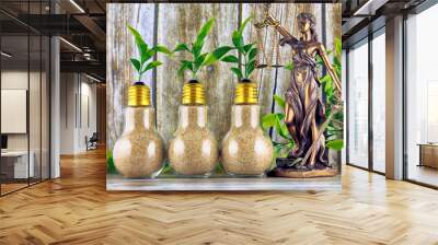 Symbol of law and justice and plants growing inside the light bulbs. Green eco renewable energy concept. Regulations, restrictions, prohibition. Wall mural